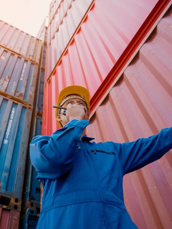 Foreman control loading Containers box to truck for Logistic Import Export.